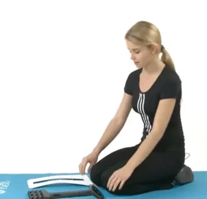 Woman showing how to position ErgoBack components in order to start assembly