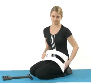 Woman showing how to pre-bend ErgoBack for assembly